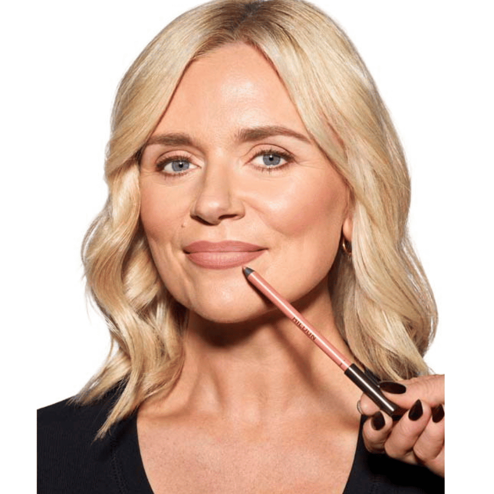 Woman model holding Hildun Beauty Darcy lip liner to her face
